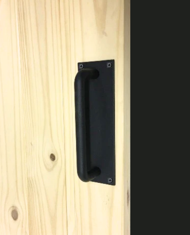 Black door handle on a wooden door